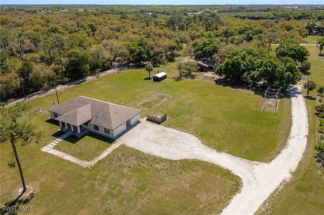 bird's eye view featuring a view of trees