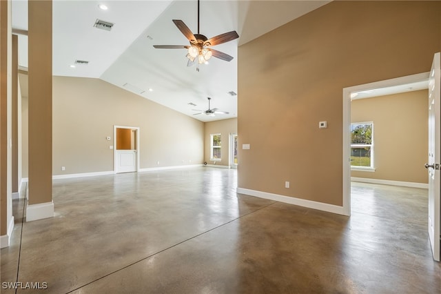 unfurnished room with visible vents, baseboards, concrete flooring, high vaulted ceiling, and a ceiling fan