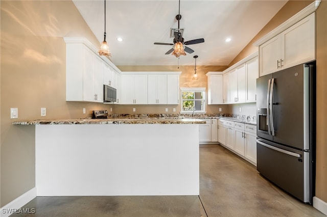 kitchen with light stone counters, finished concrete flooring, lofted ceiling, a peninsula, and appliances with stainless steel finishes