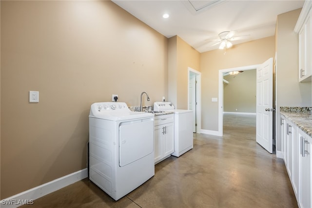 washroom with washer / clothes dryer, cabinet space, baseboards, and a sink