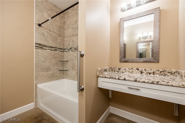 full bathroom featuring tub / shower combination and baseboards