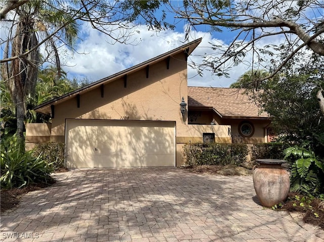 view of front of property with a garage