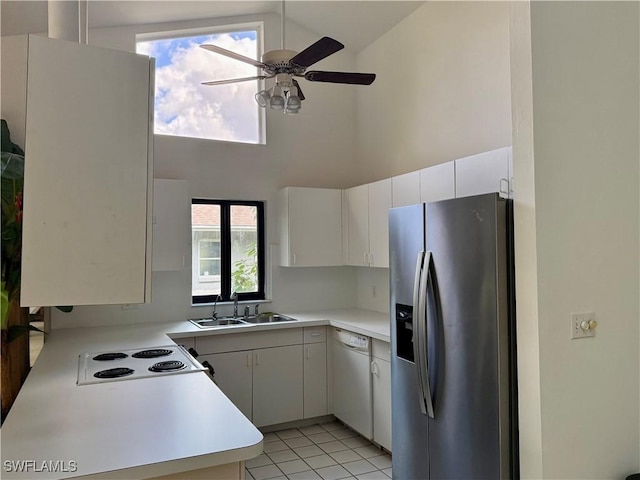 kitchen featuring white cabinetry, high vaulted ceiling, sink, and white appliances