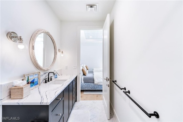 bathroom with a healthy amount of sunlight and vanity