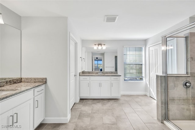 bathroom with vanity and walk in shower