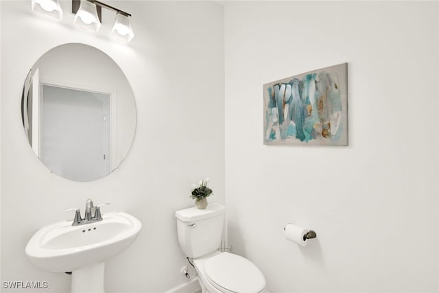 bathroom featuring sink and toilet