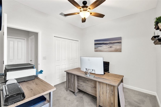 home office featuring ceiling fan and light colored carpet