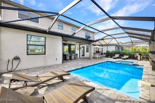 view of pool featuring a bar, a lanai, an outdoor hangout area, and a patio