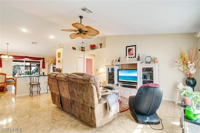 living room with vaulted ceiling, sink, and ceiling fan with notable chandelier