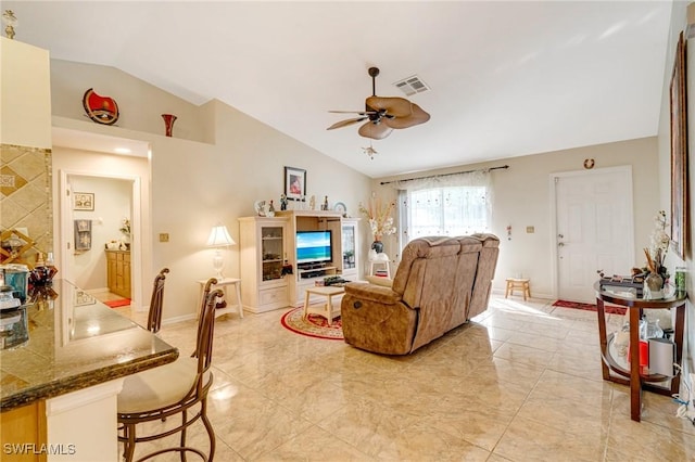 living room featuring vaulted ceiling and ceiling fan