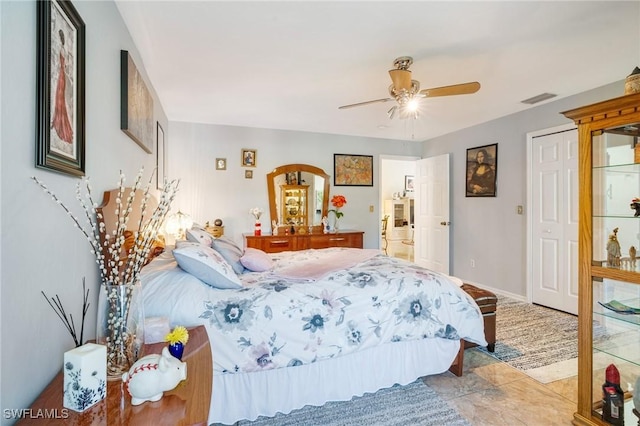 bedroom featuring ceiling fan and light tile patterned floors