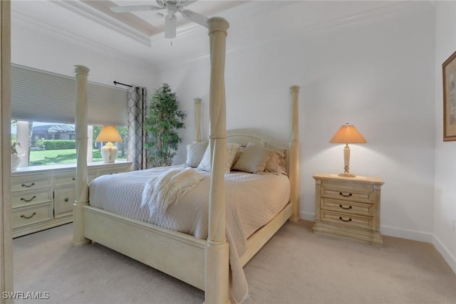 carpeted bedroom with crown molding and ceiling fan