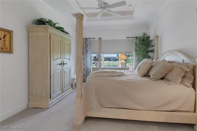 bedroom featuring decorative columns, ornamental molding, light colored carpet, and ceiling fan