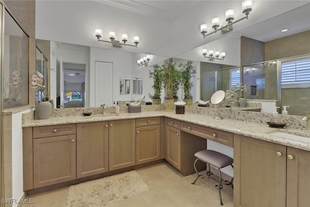 bathroom with vanity and a shower with shower door