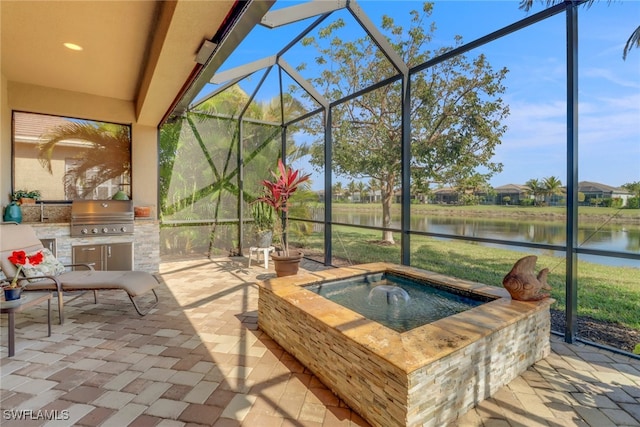 sunroom with a jacuzzi and a water view