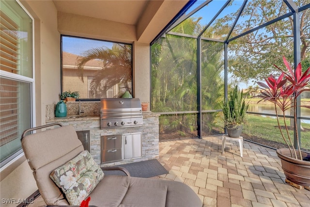 sunroom featuring sink