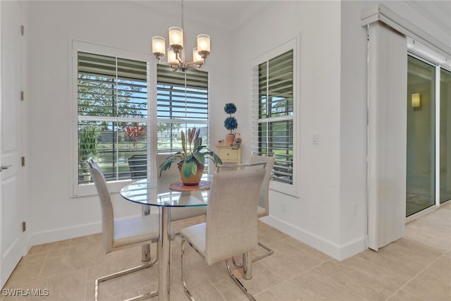 dining room featuring an inviting chandelier, a healthy amount of sunlight, and light tile patterned floors