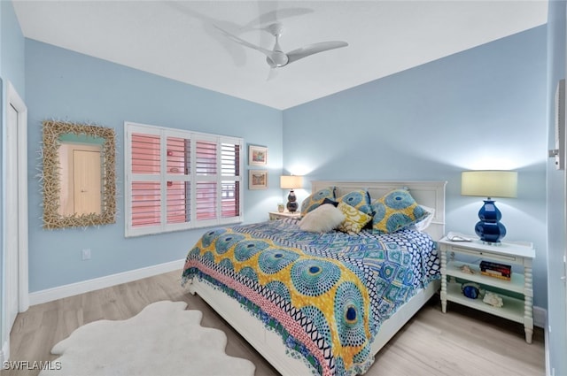 bedroom featuring light hardwood / wood-style flooring and ceiling fan