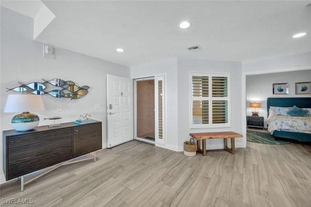 bedroom with light hardwood / wood-style floors