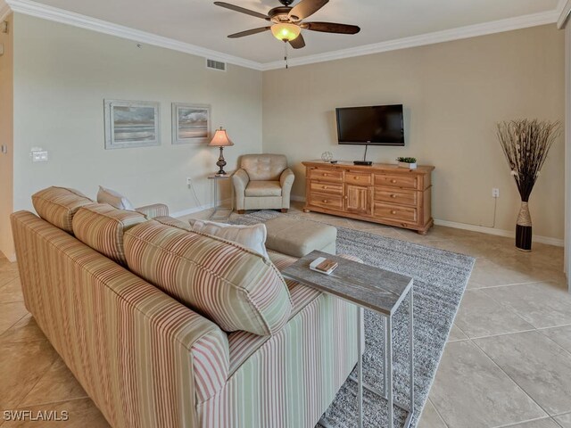 tiled living room featuring ornamental molding and ceiling fan