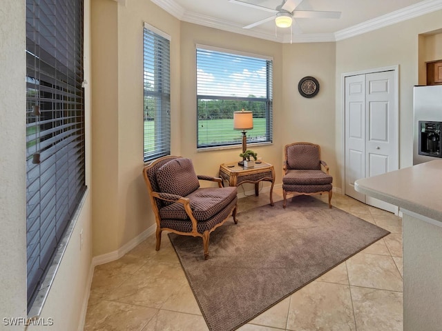 living area with crown molding, light tile patterned floors, and ceiling fan