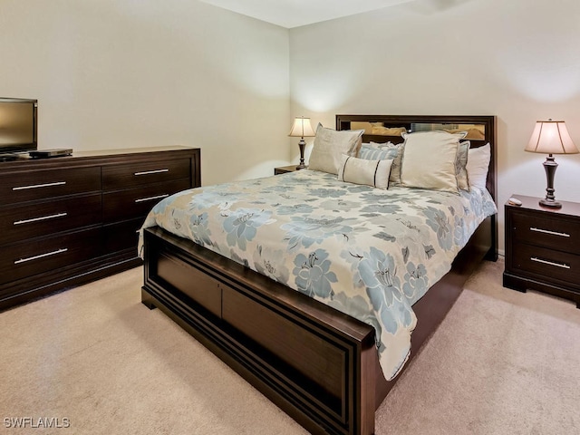 bedroom featuring light carpet