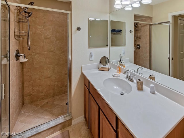 bathroom featuring vanity and a shower with shower door