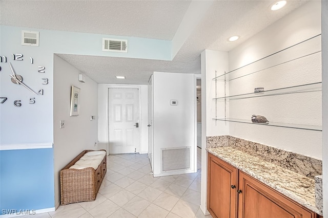 bathroom with a textured ceiling