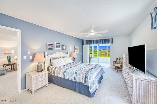 carpeted bedroom with access to outside and ceiling fan