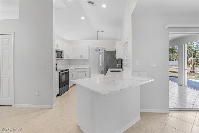 kitchen with sink, kitchen peninsula, stainless steel appliances, light stone countertops, and white cabinets