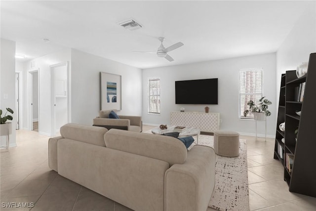 living room featuring ceiling fan and light tile patterned floors