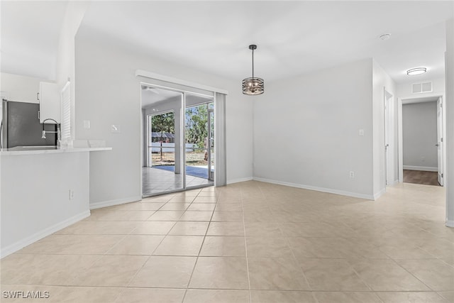 view of tiled spare room