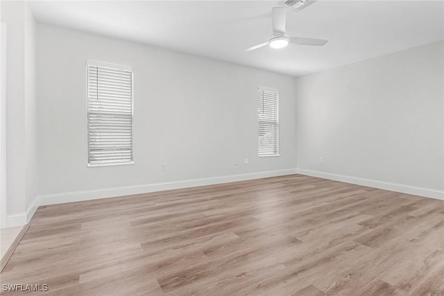 unfurnished room featuring ceiling fan and light hardwood / wood-style flooring