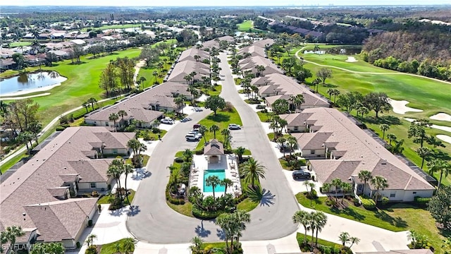 aerial view featuring a water view, a residential view, and view of golf course