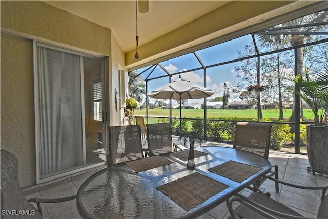sunroom / solarium featuring outdoor dining space