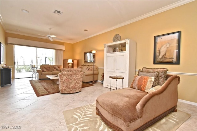 living room featuring crown molding, a ceiling fan, visible vents, and light tile patterned floors