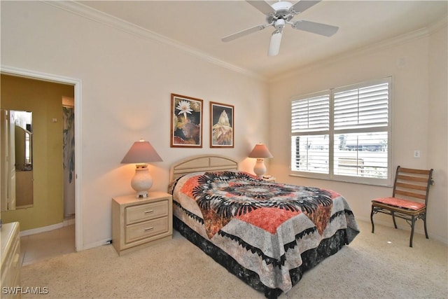 carpeted bedroom with crown molding and ceiling fan