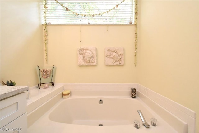 full bath featuring a garden tub and plenty of natural light