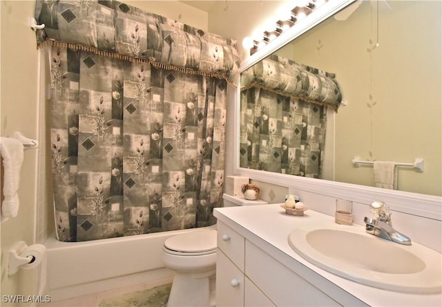 bathroom featuring shower / bathtub combination with curtain, toilet, and vanity