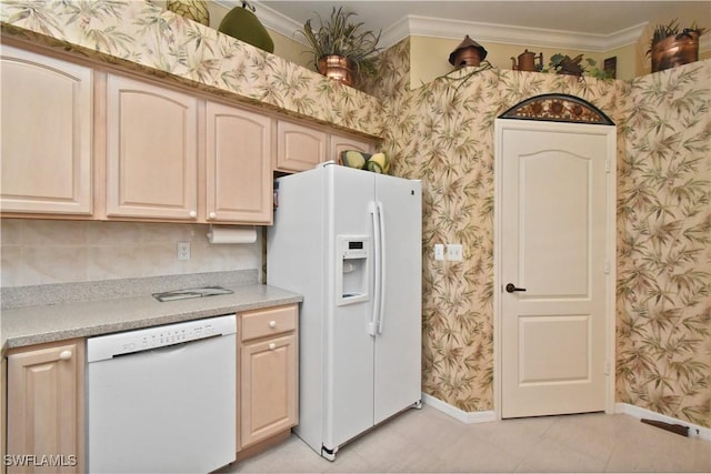 kitchen with white appliances, crown molding, baseboards, light countertops, and wallpapered walls