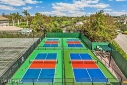 view of sport court featuring fence