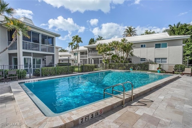 view of swimming pool with a patio area