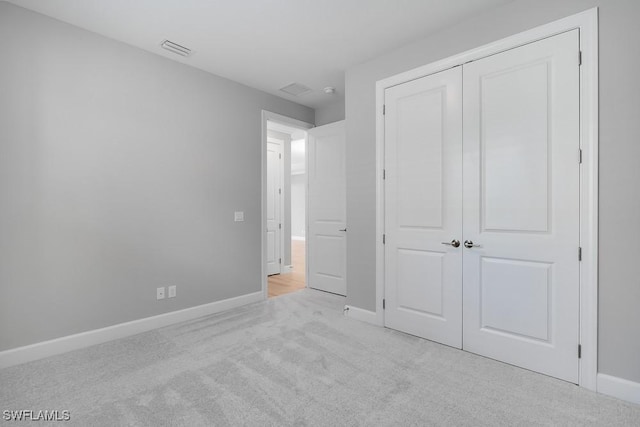 26930 Lark Ct, Punta Gorda, FL 33955 - unfurnished bedroom with carpet, baseboards, and a closet