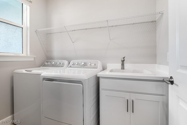 26930 Lark Ct, Punta Gorda, FL 33955 - washroom featuring separate washer and dryer and cabinet space