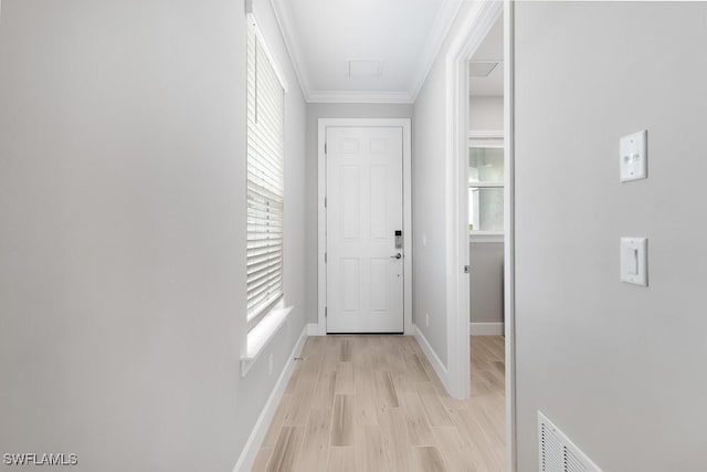 26930 Lark Ct, Punta Gorda, FL 33955 - corridor with plenty of natural light, ornamental molding, baseboards, and light wood-type flooring