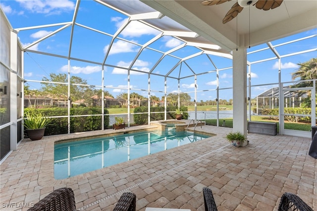 view of pool featuring a water view, an in ground hot tub, a lanai, and a patio