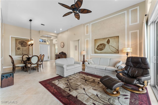 living room with ceiling fan and light tile patterned floors