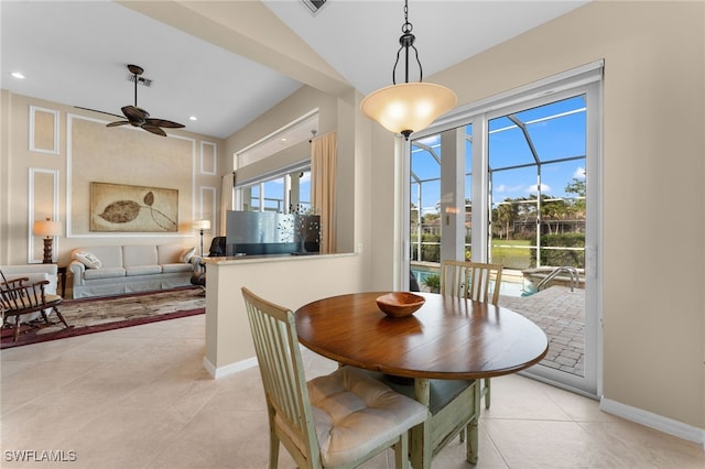 tiled dining space featuring ceiling fan