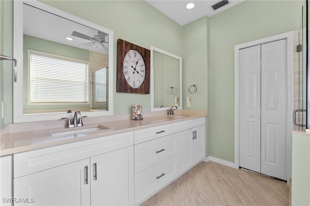 bathroom with vanity, wood-type flooring, and ceiling fan