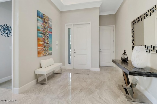 foyer featuring ornamental molding